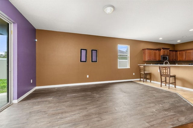 326 Highland Meadows Ave, Davenport, FL 33837 - living room with light wood-type flooring, baseboards, and recessed lighting