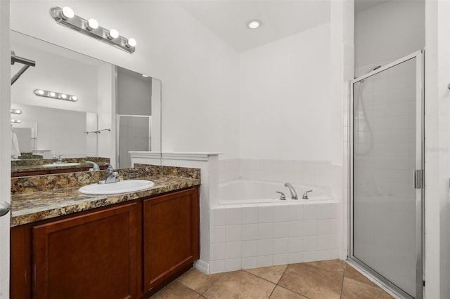 326 Highland Meadows Ave, Davenport, FL 33837 - bathroom with vanity, a bath, a shower stall, and tile patterned flooring