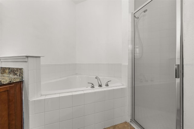 326 Highland Meadows Ave, Davenport, FL 33837 - bathroom featuring a garden tub, a shower stall, and vanity