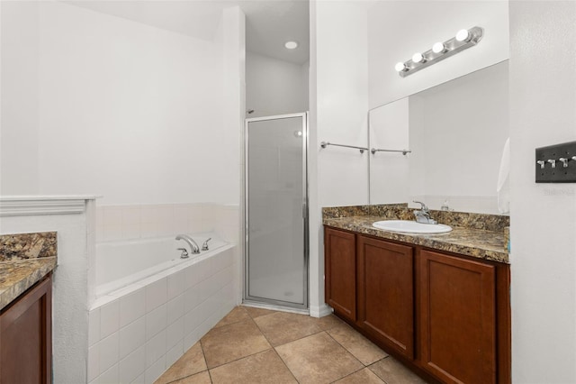 326 Highland Meadows Ave, Davenport, FL 33837 - full bathroom with vanity, a stall shower, tile patterned flooring, and a garden tub