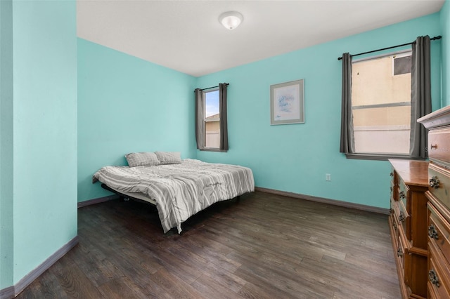 326 Highland Meadows Ave, Davenport, FL 33837 - bedroom featuring wood finished floors and baseboards
