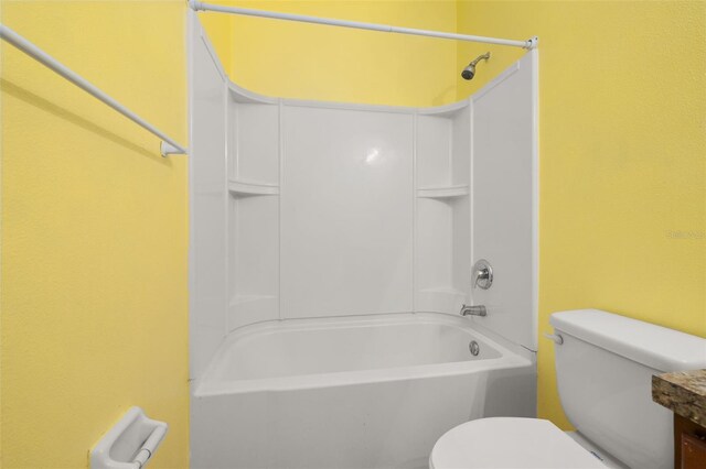 326 Highland Meadows Ave, Davenport, FL 33837 - full bathroom featuring toilet,  shower combination, and vanity