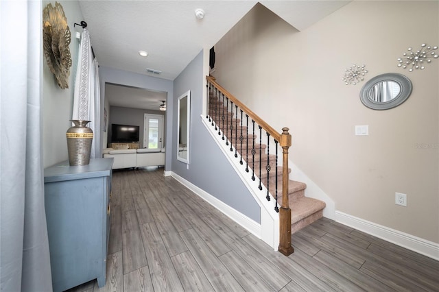 1335 Greenfield Loop, Kissimmee, FL 34747 - entrance foyer featuring stairway, wood finished floors, baseboards, and a ceiling fan