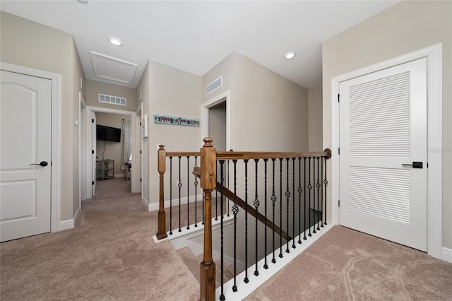 1335 Greenfield Loop, Kissimmee, FL 34747 - hallway with carpet, an upstairs landing, baseboards, recessed lighting, and attic access