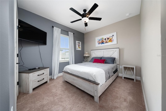 1335 Greenfield Loop, Kissimmee, FL 34747 - bedroom featuring light carpet, baseboards, and ceiling fan