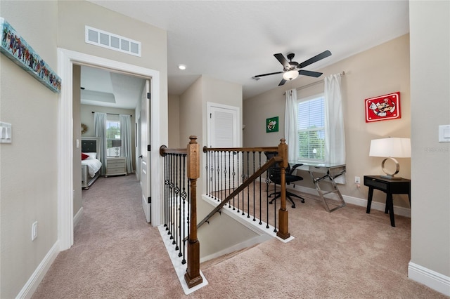 1335 Greenfield Loop, Kissimmee, FL 34747 - hallway featuring an upstairs landing, carpet, and baseboards