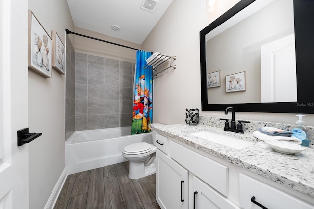 1335 Greenfield Loop, Kissimmee, FL 34747 - full bath featuring vanity, wood finished floors, toilet, and shower / tub combo