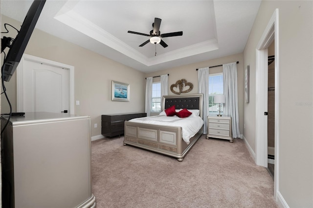 1335 Greenfield Loop, Kissimmee, FL 34747 - carpeted bedroom featuring a raised ceiling, baseboards, crown molding, and ceiling fan
