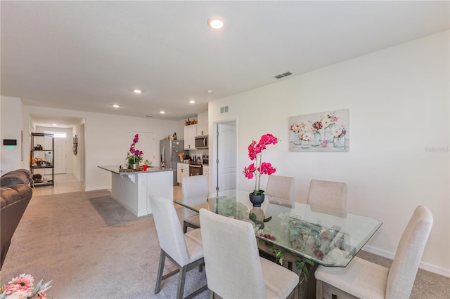 1102 Tupelo Trl, Haines City, FL 33844 - dining space featuring light carpet and recessed lighting