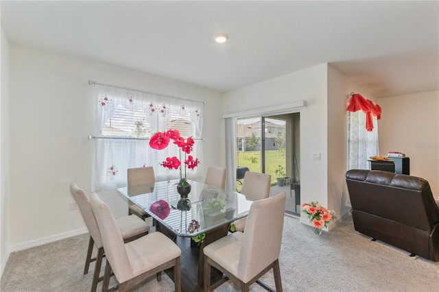 1102 Tupelo Trl, Haines City, FL 33844 - dining area with carpet flooring and baseboards