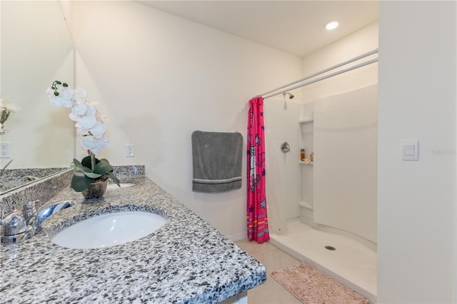 1102 Tupelo Trl, Haines City, FL 33844 - bathroom featuring a shower stall, tile patterned floors, and double vanity