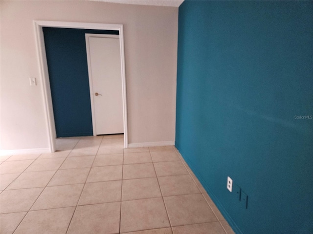 2805 Rodeo Dr, Kissimmee, FL 34746 - spare room featuring light tile patterned floors and baseboards