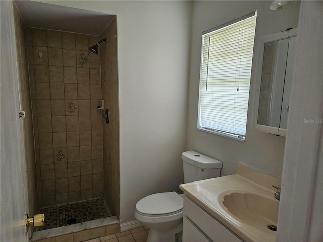 2805 Rodeo Dr, Kissimmee, FL 34746 - bathroom with vanity, toilet, a tile shower, and tile patterned flooring