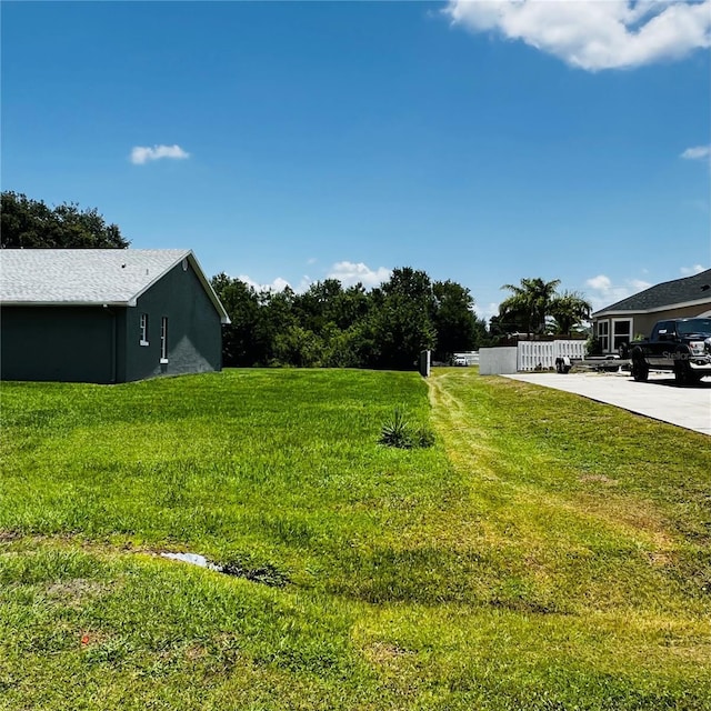 2805 Rodeo Dr, Kissimmee, FL 34746 - view of yard with concrete driveway