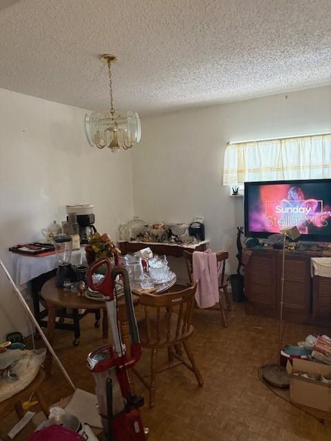 4339 Solomon Dr, Orlando, FL 32811 - dining area with a chandelier and a textured ceiling