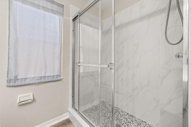 2146 Fish Eagle St, Clermont, FL 34714 - bathroom with a shower stall and baseboards