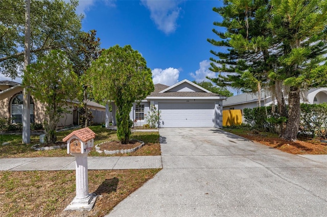 2146 Fish Eagle St, Clermont, FL 34714 - view of front of home with driveway and a garage