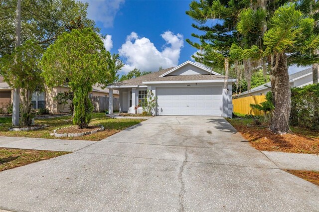 2146 Fish Eagle St, Clermont, FL 34714 - ranch-style home featuring driveway, a garage, and stucco siding
