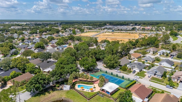 2146 Fish Eagle St, Clermont, FL 34714 - aerial view of property's location featuring a pool and nearby suburban area