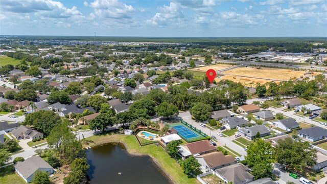 2146 Fish Eagle St, Clermont, FL 34714 - aerial view of property and surrounding area with a nearby body of water and nearby suburban area