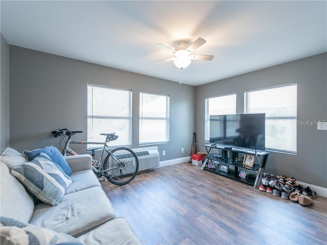 405 Eron Way Unit 39, Winter Garden, FL 34787 - living area with a ceiling fan, baseboards, wood finished floors, and a wall mounted AC