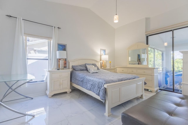 121 White Birch Dr, Kissimmee, FL 34743 - bedroom with light marble finish flooring, access to exterior, and lofted ceiling