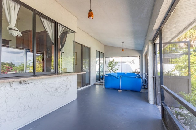 121 White Birch Dr, Kissimmee, FL 34743 - unfurnished sunroom with healthy amount of natural light and vaulted ceiling