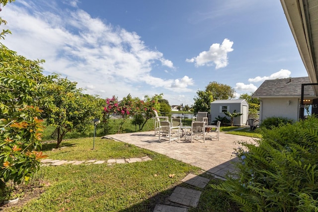 121 White Birch Dr, Kissimmee, FL 34743 - view of green lawn featuring a shed and a patio