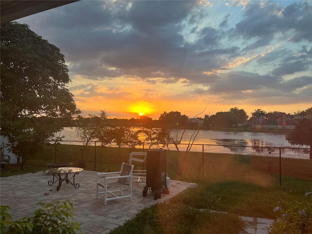 121 White Birch Dr, Kissimmee, FL 34743 - patio terrace at dusk with a patio area and a water view