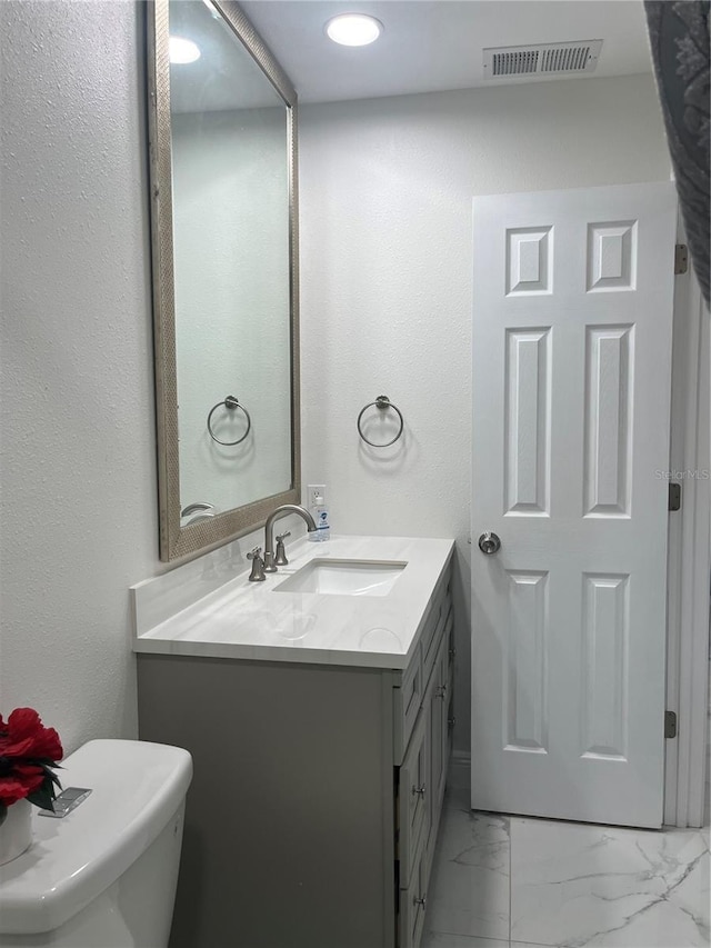 121 White Birch Dr, Kissimmee, FL 34743 - bathroom featuring vanity and marble finish floors