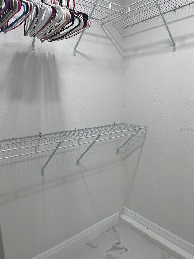 121 White Birch Dr, Kissimmee, FL 34743 - spacious closet featuring light marble finish flooring