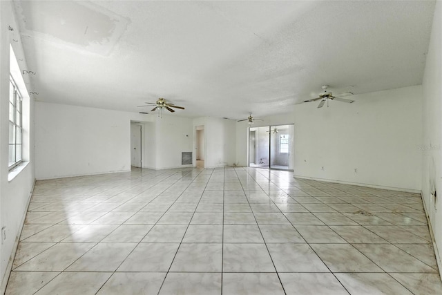 3252 Golfview Rd, Sebring, FL 33875 - empty room with ceiling fan, light tile patterned floors, and a textured ceiling