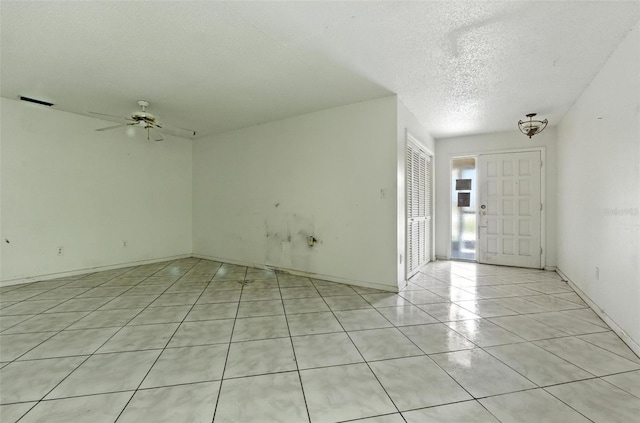 3252 Golfview Rd, Sebring, FL 33875 - spare room with a textured ceiling, ceiling fan, and light tile patterned floors
