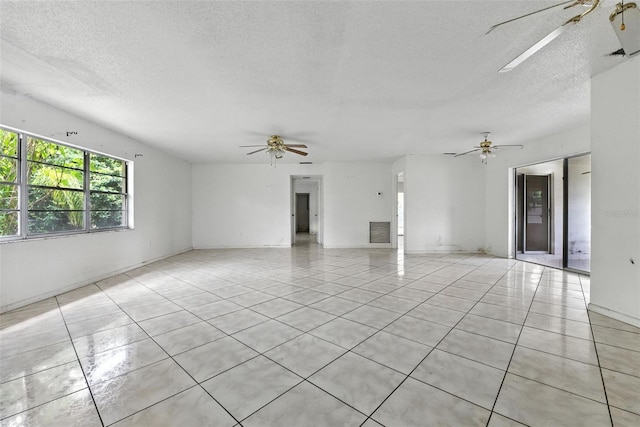 3252 Golfview Rd, Sebring, FL 33875 - spare room with ceiling fan, a textured ceiling, and light tile patterned floors