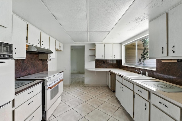 3252 Golfview Rd, Sebring, FL 33875 - kitchen with white appliances, under cabinet range hood, tasteful backsplash, open shelves, and white cabinets