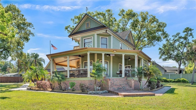 822 W Patterson St, Lakeland, FL 33803 - victorian-style house with a ceiling fan, a porch, and stairs