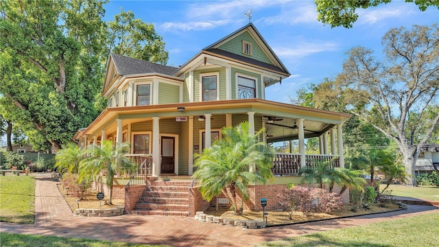 822 W Patterson St, Lakeland, FL 33803 - victorian-style house with a porch and a ceiling fan