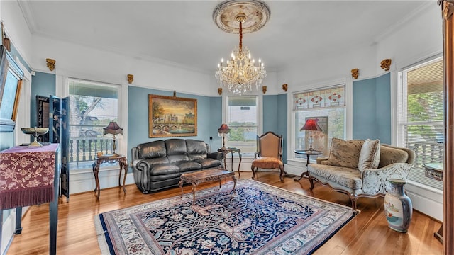 822 W Patterson St, Lakeland, FL 33803 - living area featuring a chandelier, wood finished floors, and ornamental molding