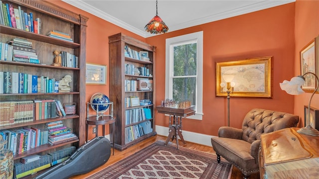 822 W Patterson St, Lakeland, FL 33803 - sitting room with wood finished floors, crown molding, and baseboards