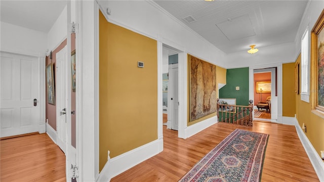822 W Patterson St, Lakeland, FL 33803 - corridor with wood finished floors, baseboards, and an upstairs landing