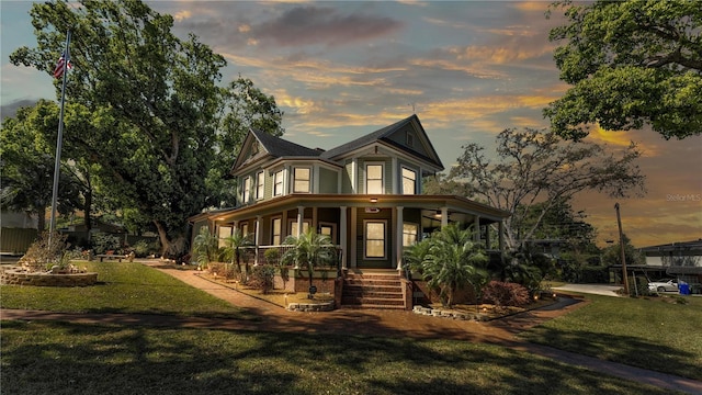 822 W Patterson St, Lakeland, FL 33803 - victorian-style house with a porch and a front lawn