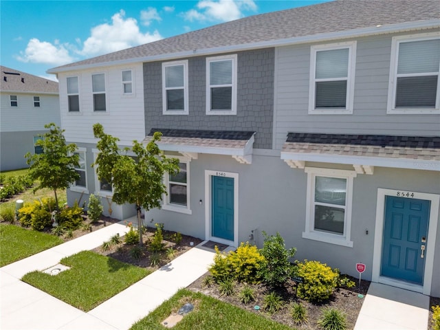 8540 Daybreak St, Sarasota, FL 34241 - townhome / multi-family property with a shingled roof