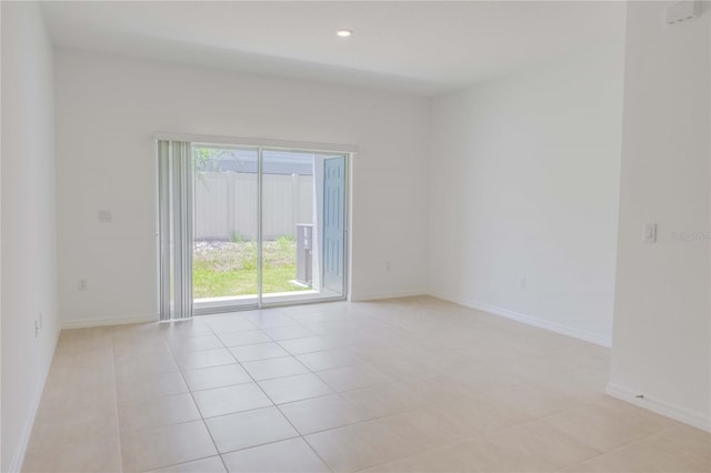 8540 Daybreak St, Sarasota, FL 34241 - spare room featuring light tile patterned floors, baseboards, and recessed lighting
