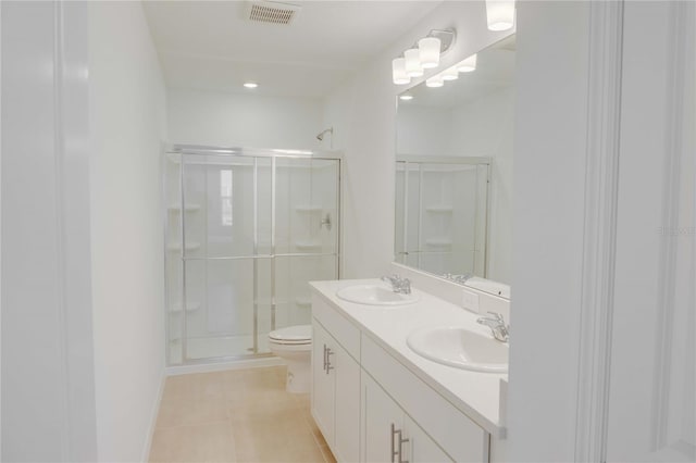 8540 Daybreak St, Sarasota, FL 34241 - full bath with a shower stall, tile patterned floors, double vanity, and toilet