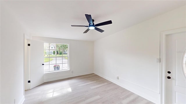 3621 Devonswood Dr, Orlando, FL 32806 - empty room with light wood-type flooring, a ceiling fan, and baseboards