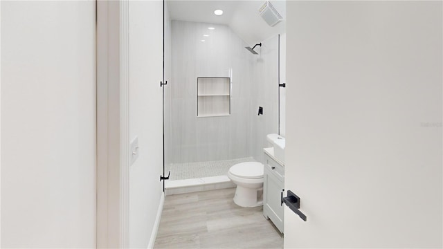 3621 Devonswood Dr, Orlando, FL 32806 - bathroom featuring toilet, a shower stall, vanity, wood finished floors, and recessed lighting