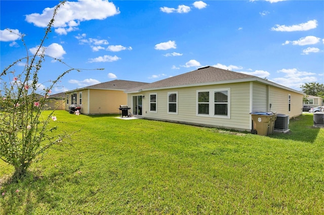 4492 Bluff Oak Loop, Kissimmee, FL 34746 - back of house with a yard, a patio area, and cooling unit