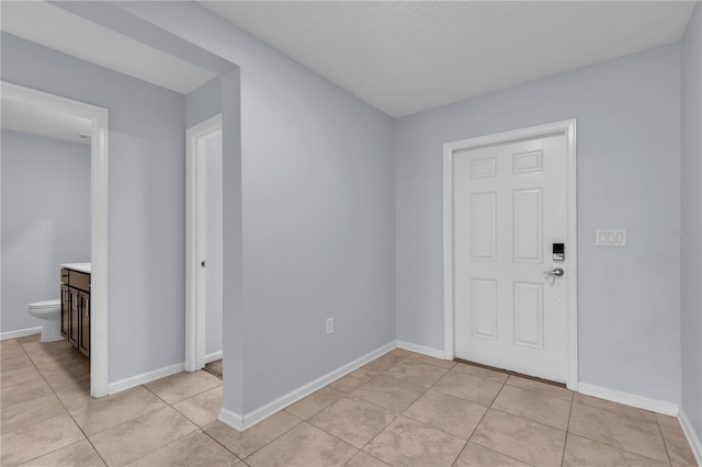 4492 Bluff Oak Loop, Kissimmee, FL 34746 - entrance foyer featuring light tile patterned floors and baseboards