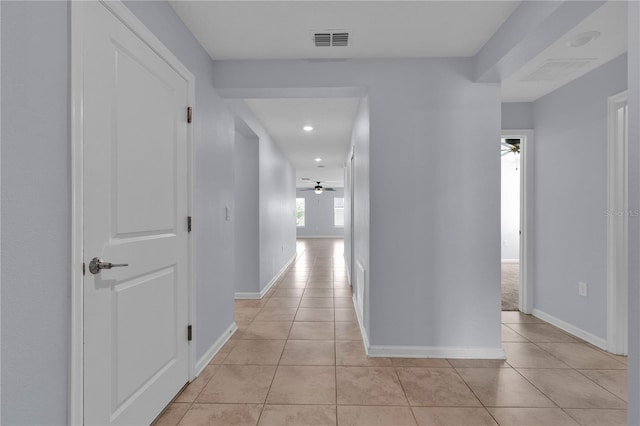 4492 Bluff Oak Loop, Kissimmee, FL 34746 - corridor featuring light tile patterned flooring, baseboards, and recessed lighting