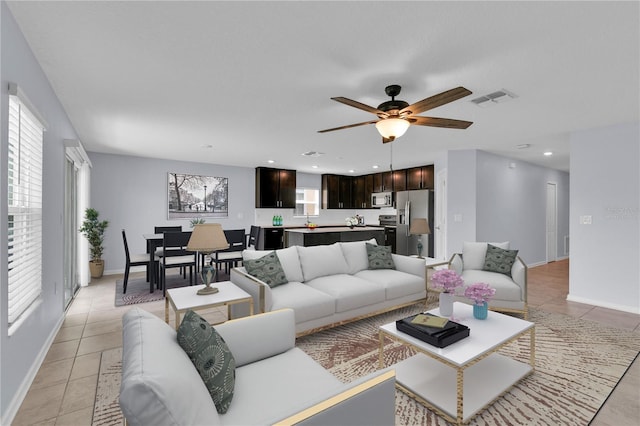 4492 Bluff Oak Loop, Kissimmee, FL 34746 - living room with plenty of natural light, baseboards, and ceiling fan